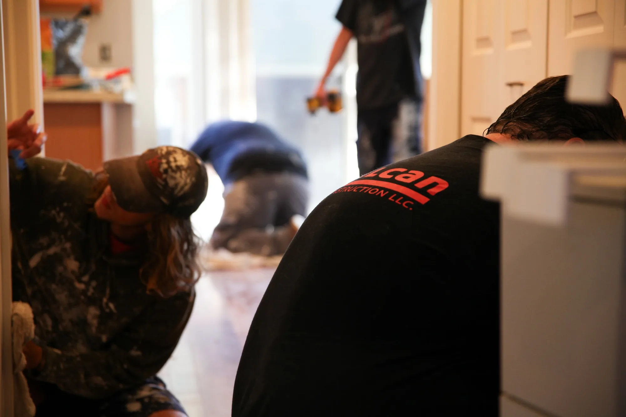 Vulcan crew members at work inside an apartment unit