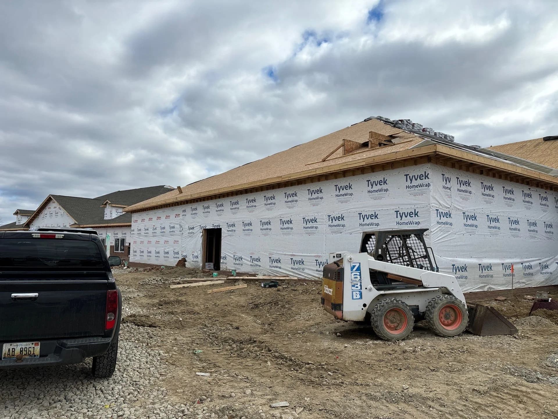 New building wrapped in house wrap during construction