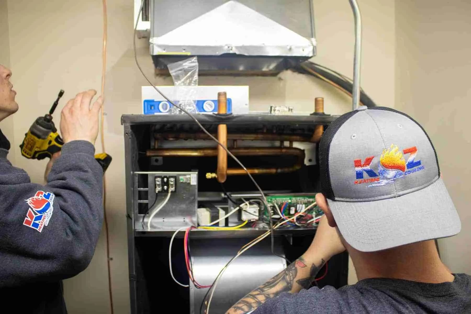 Technician working on a furnace control board