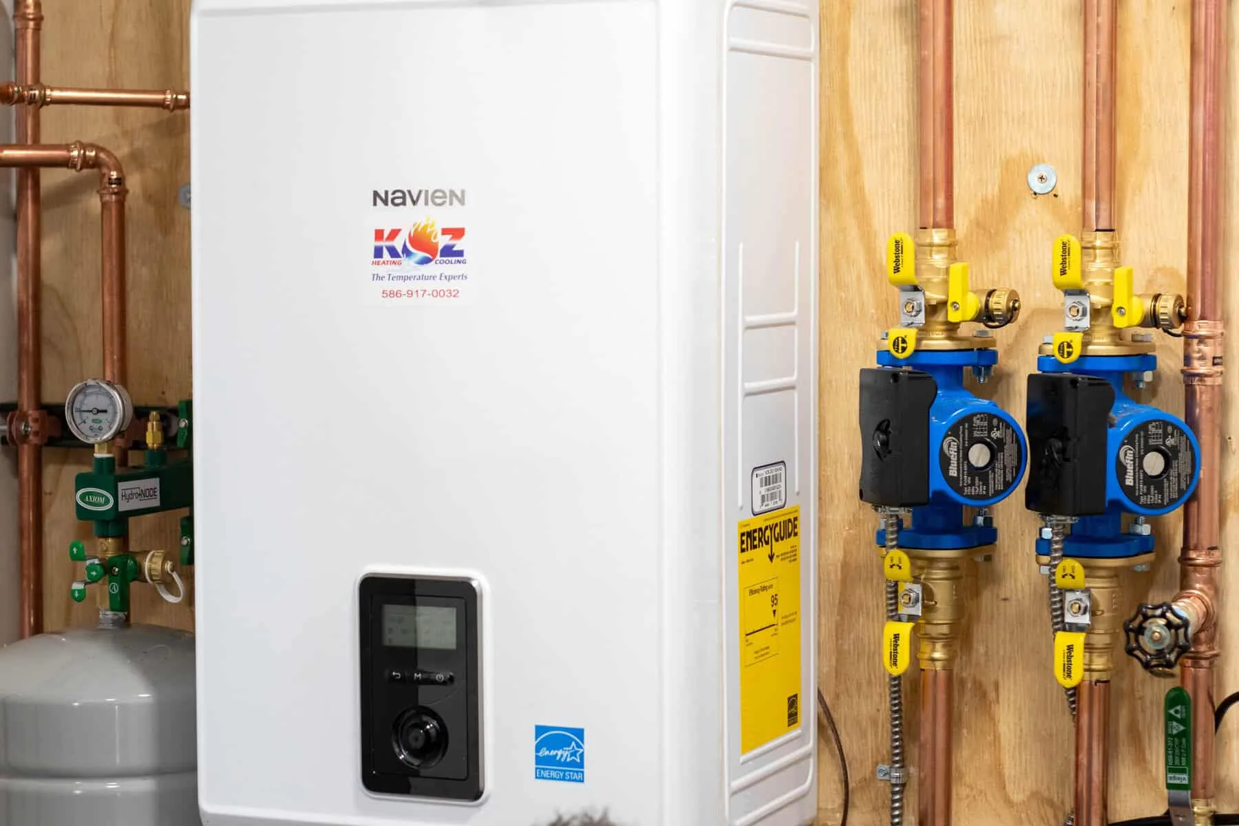 Navien wall-hung unit installed with copper piping and circulator pumps