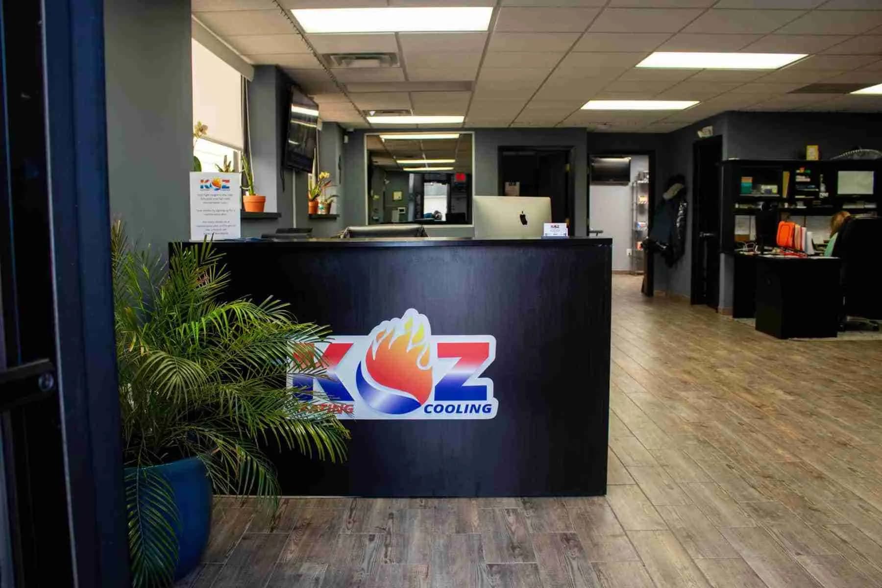 Reception desk with the Koz logo in the Sterling Heights office