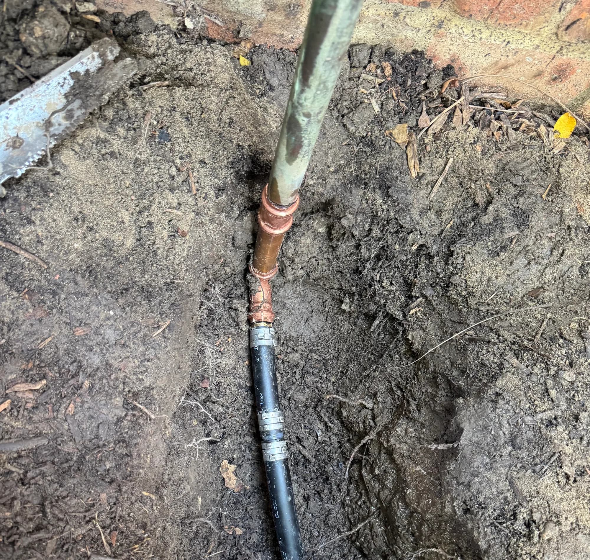 Repaired backflow downleg with a copper fitting and new poly line in Bloomfield Hills