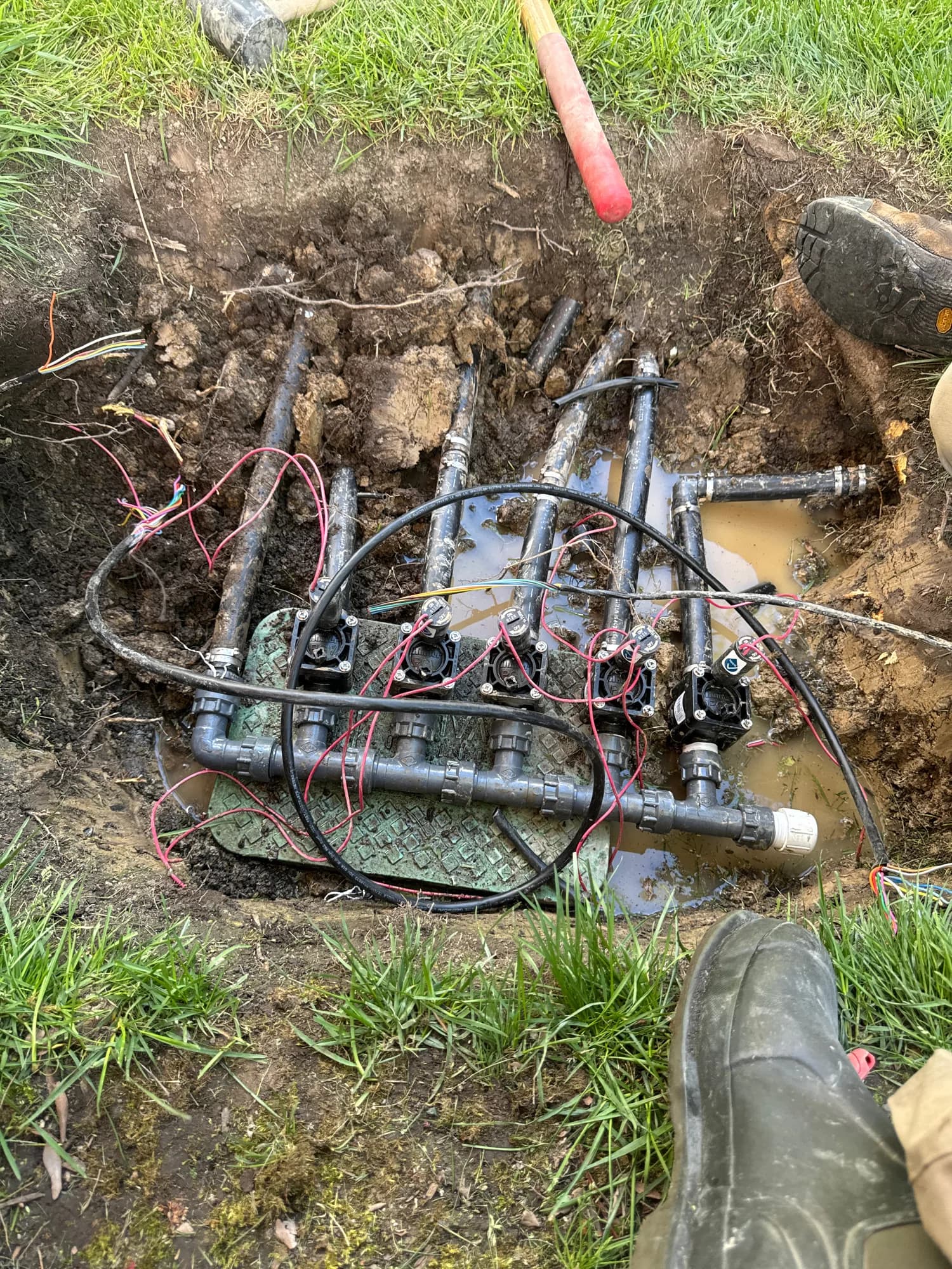 Valve manifold exposed in the ground during a rebuild