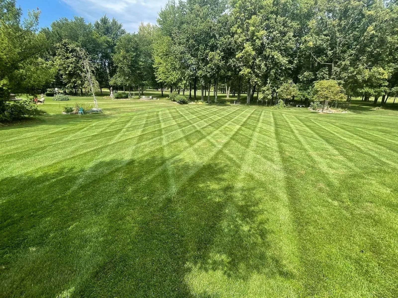 Large lawn freshly mowed in stripes