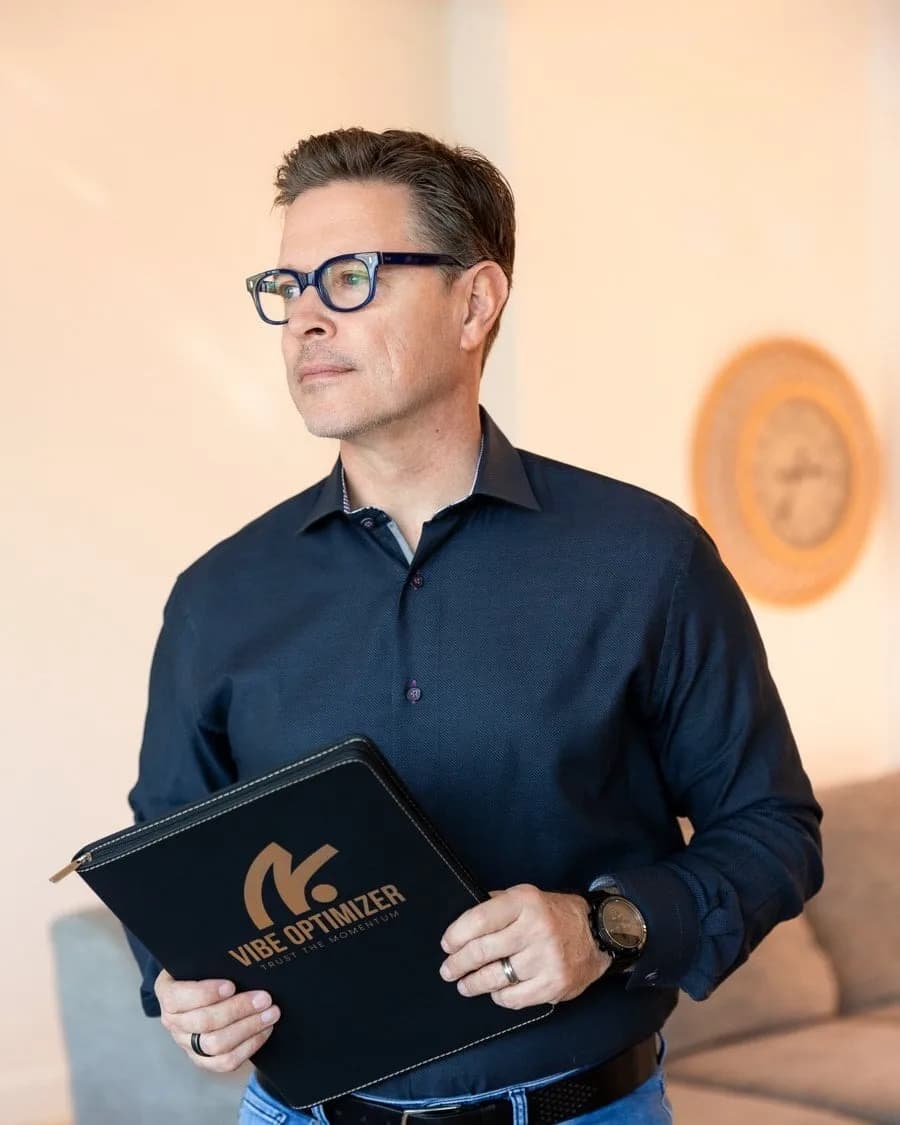 Bill Green holding a Vibe Optimizer folder