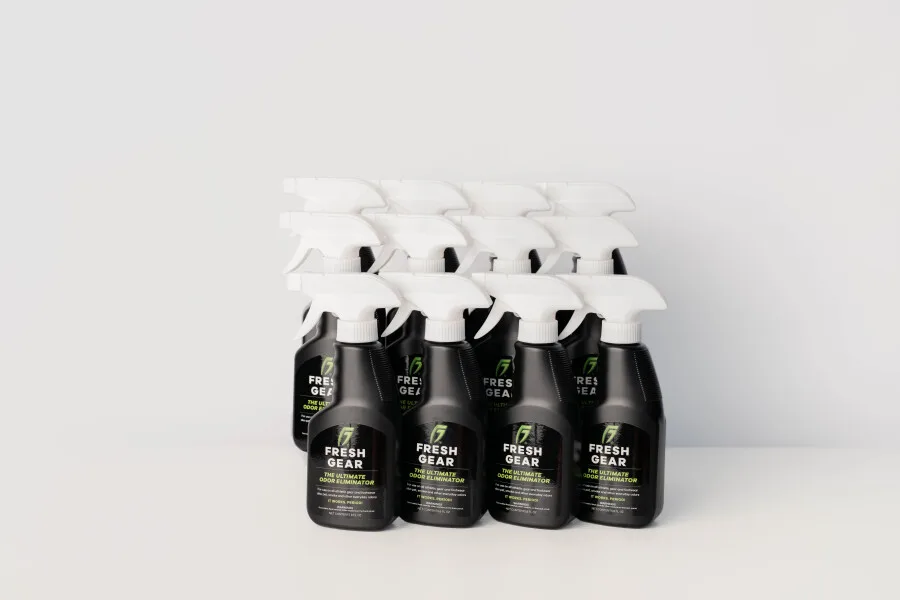 A dozen Fresh Gear spray bottles grouped together