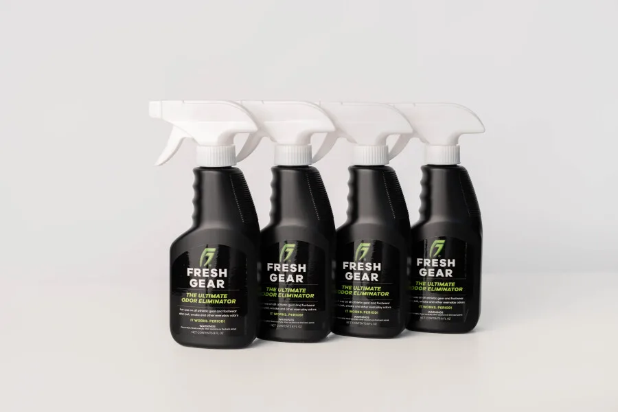 Four bottles of Fresh Gear spray in a row