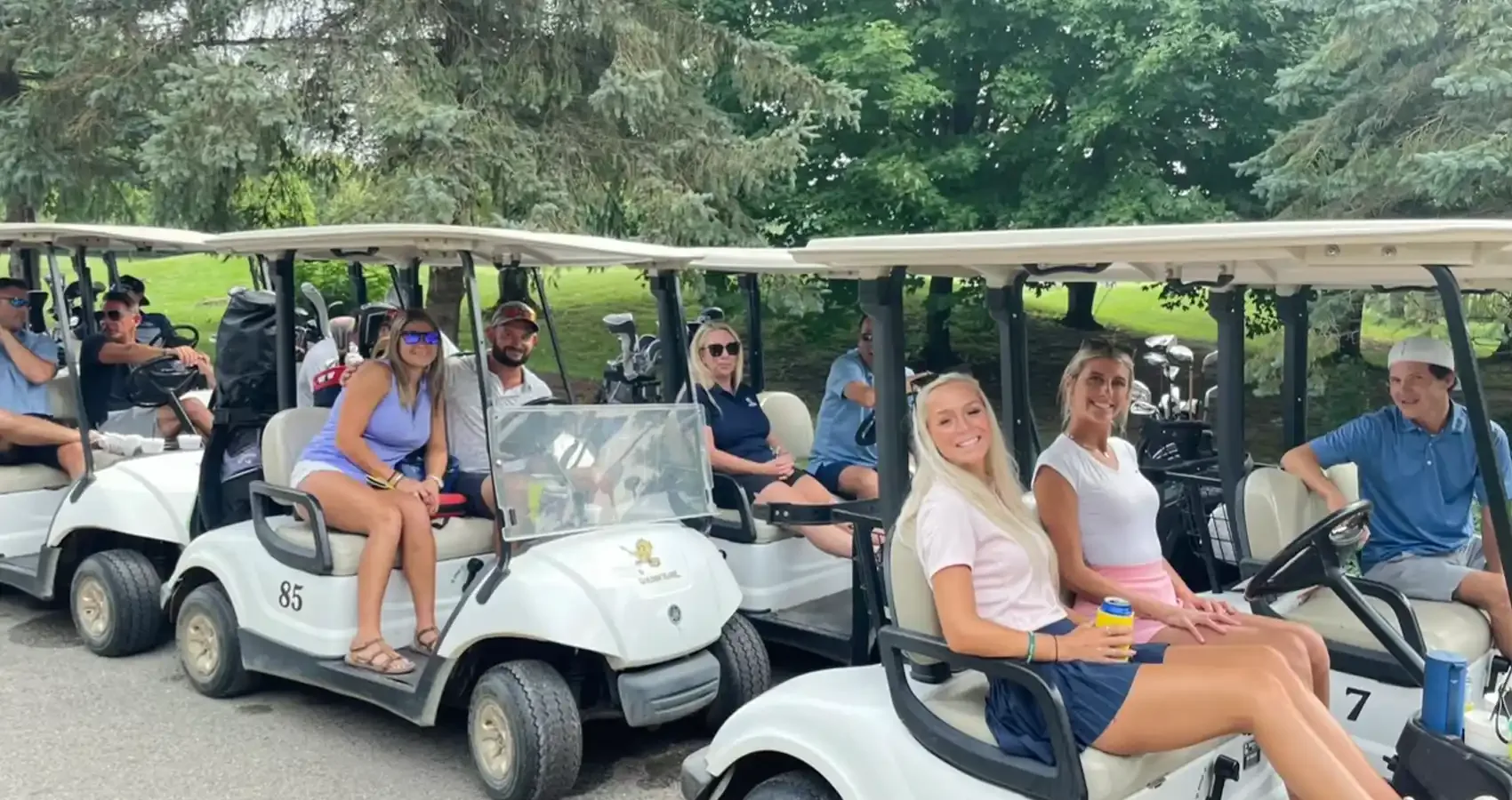 Golfers lined up in carts before a tournament