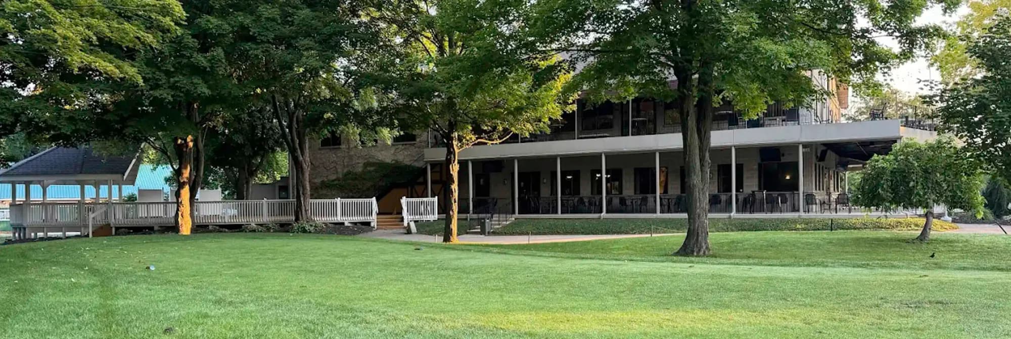 Golden Hawk clubhouse and banquet building seen across the lawn