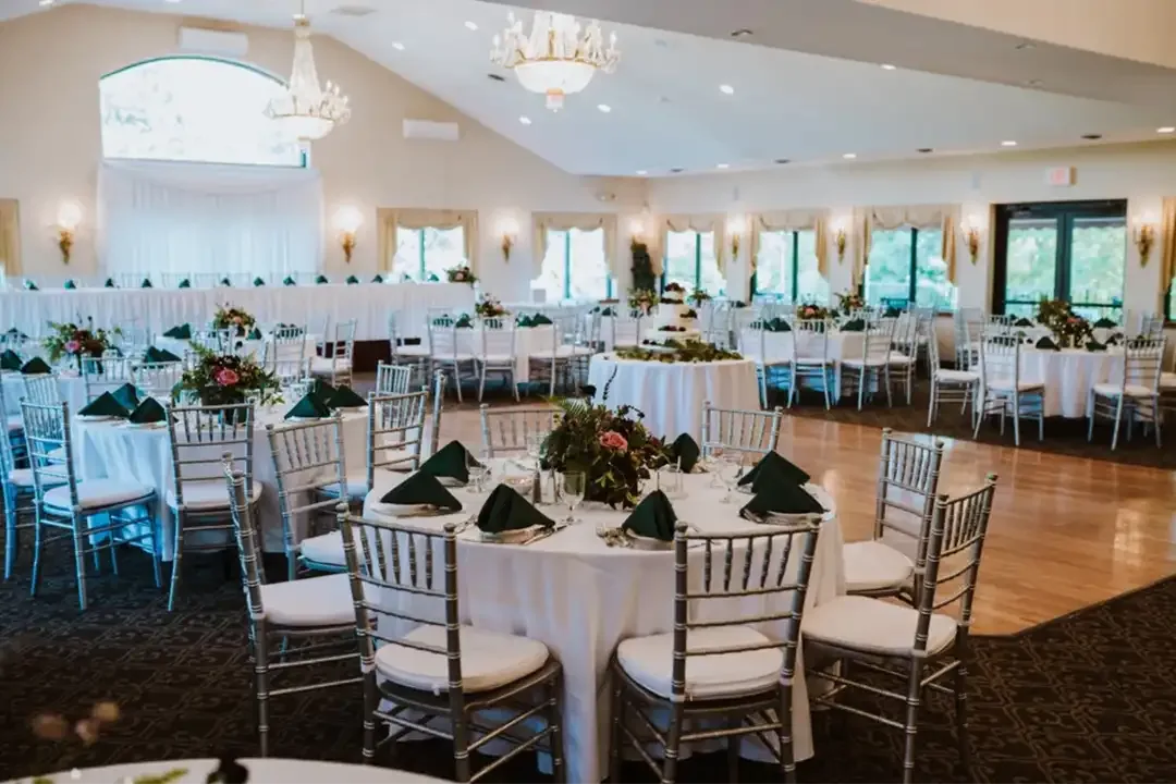 Banquet hall set with round tables and chairs