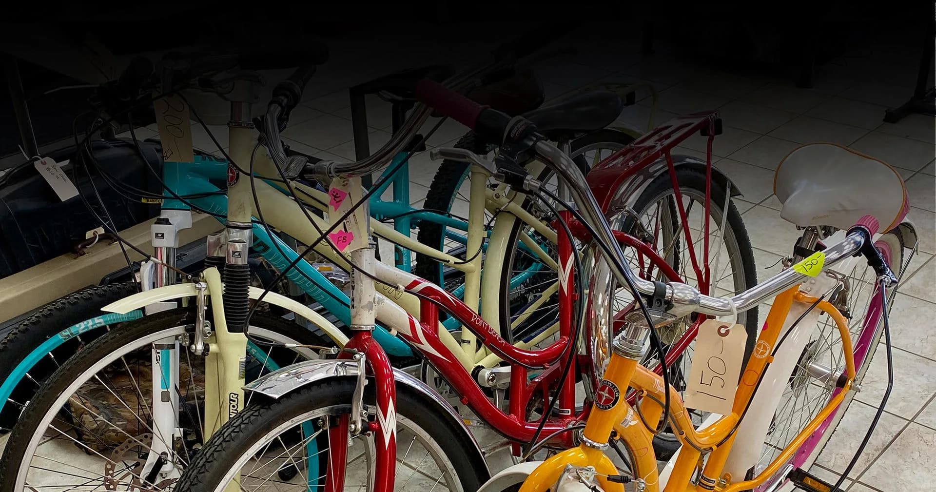 Bicycles lined up in a rack inside the store